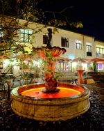 Outdoor area with fountain at night