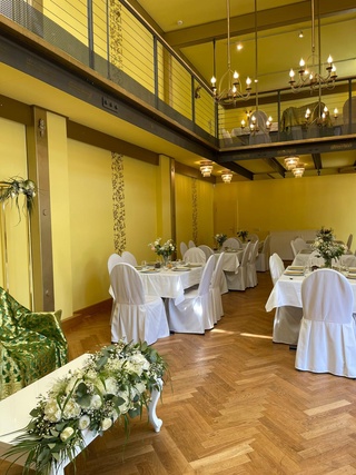 White festive seating for a wedding at the Werkhaus