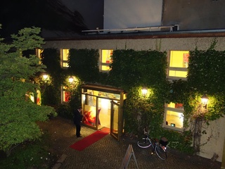 Illuminated Werkhaus in the Heckmann Courtyards at night